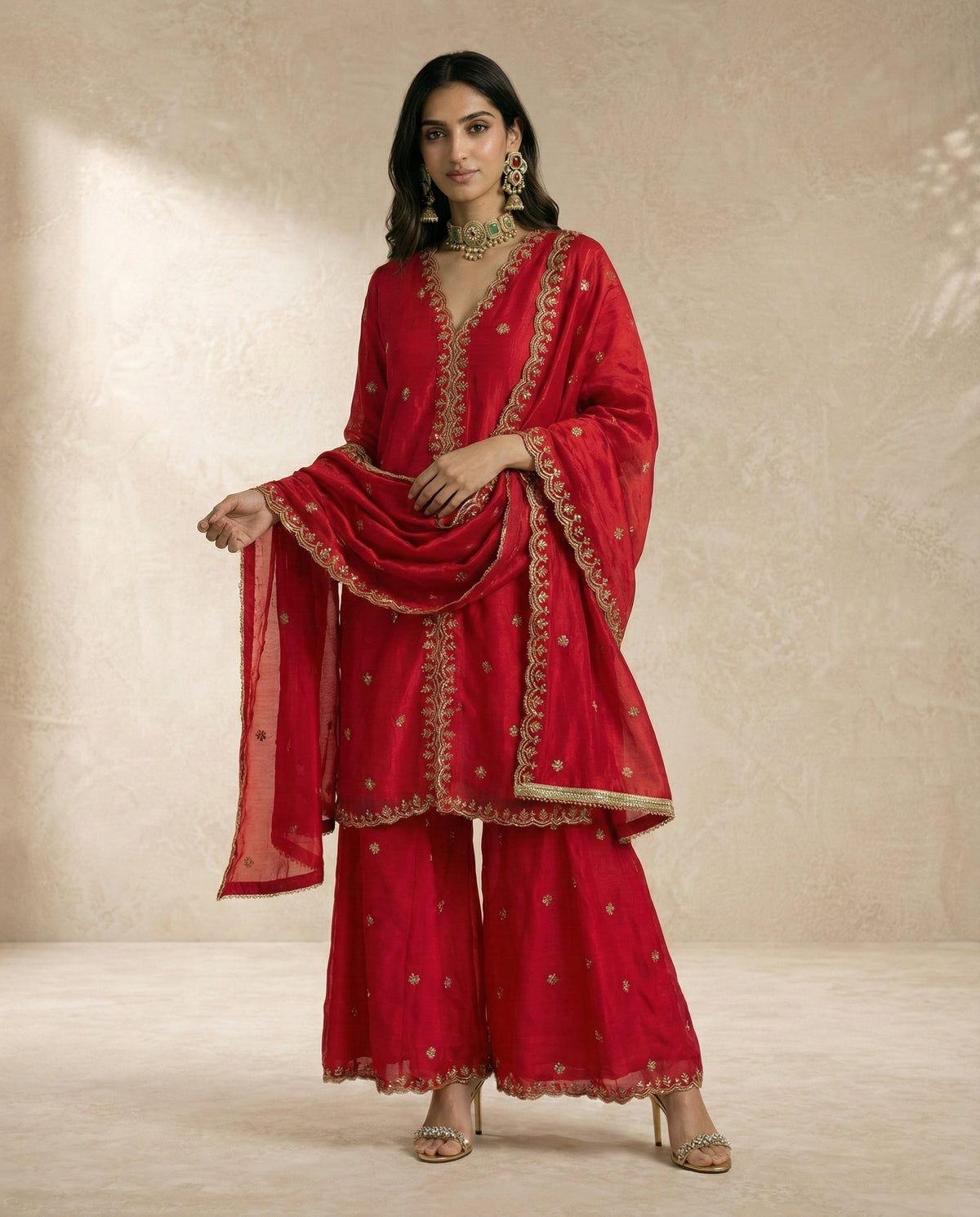 NAZRA red tissue sharara set with scallop-bordered V-neck and centre-front embroidered band.
