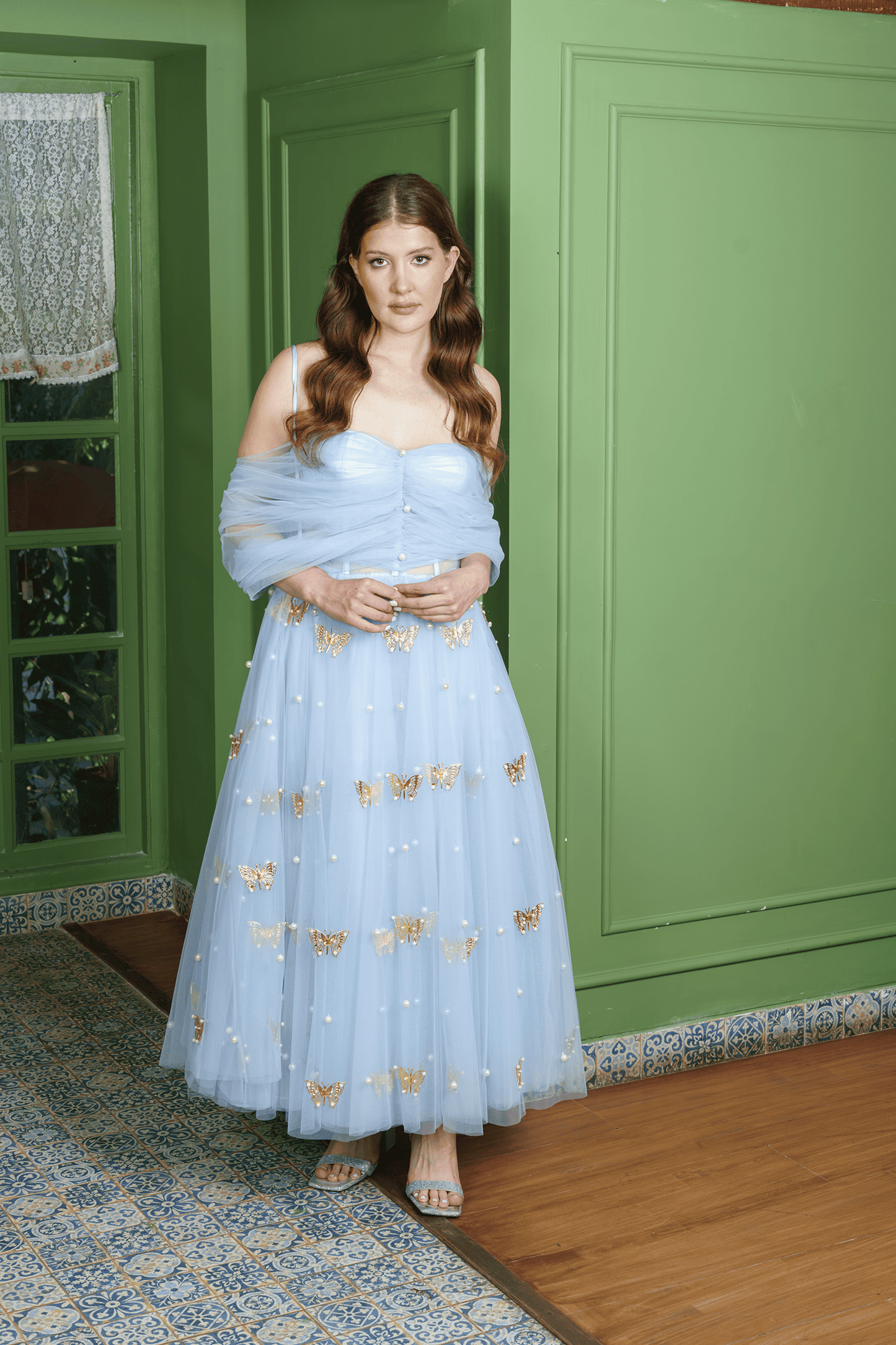 Butterfly Pearl corset gown, alternate view of the ankle-length tulle skirt with gold metal butterflies