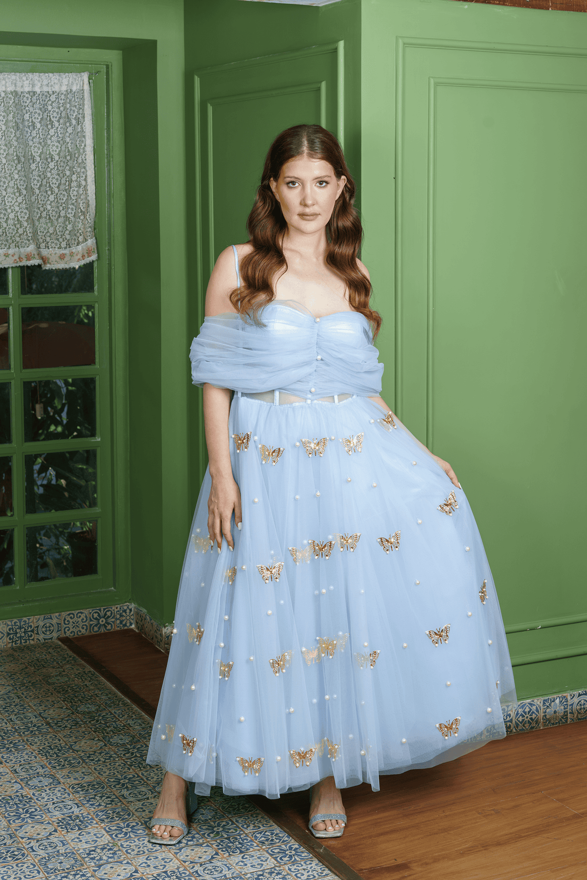 Butterfly Pearl powder blue gown — off-shoulder tulle drape, ruched bodice, signature gold metal butterflies and pearls, front view