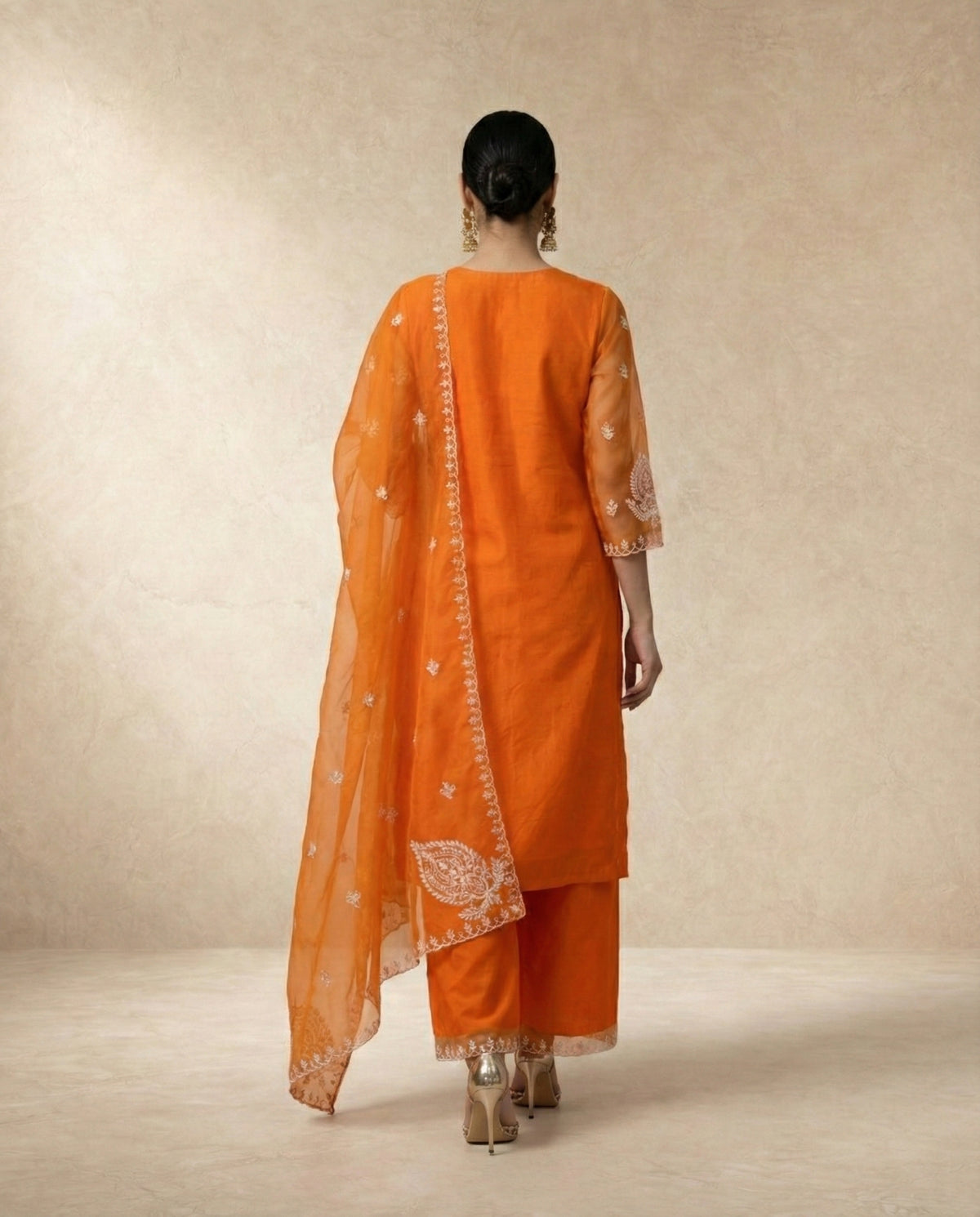 IFRA marigold organza three-piece kurta set with sheer dupatta by Neha Sharma Label.
