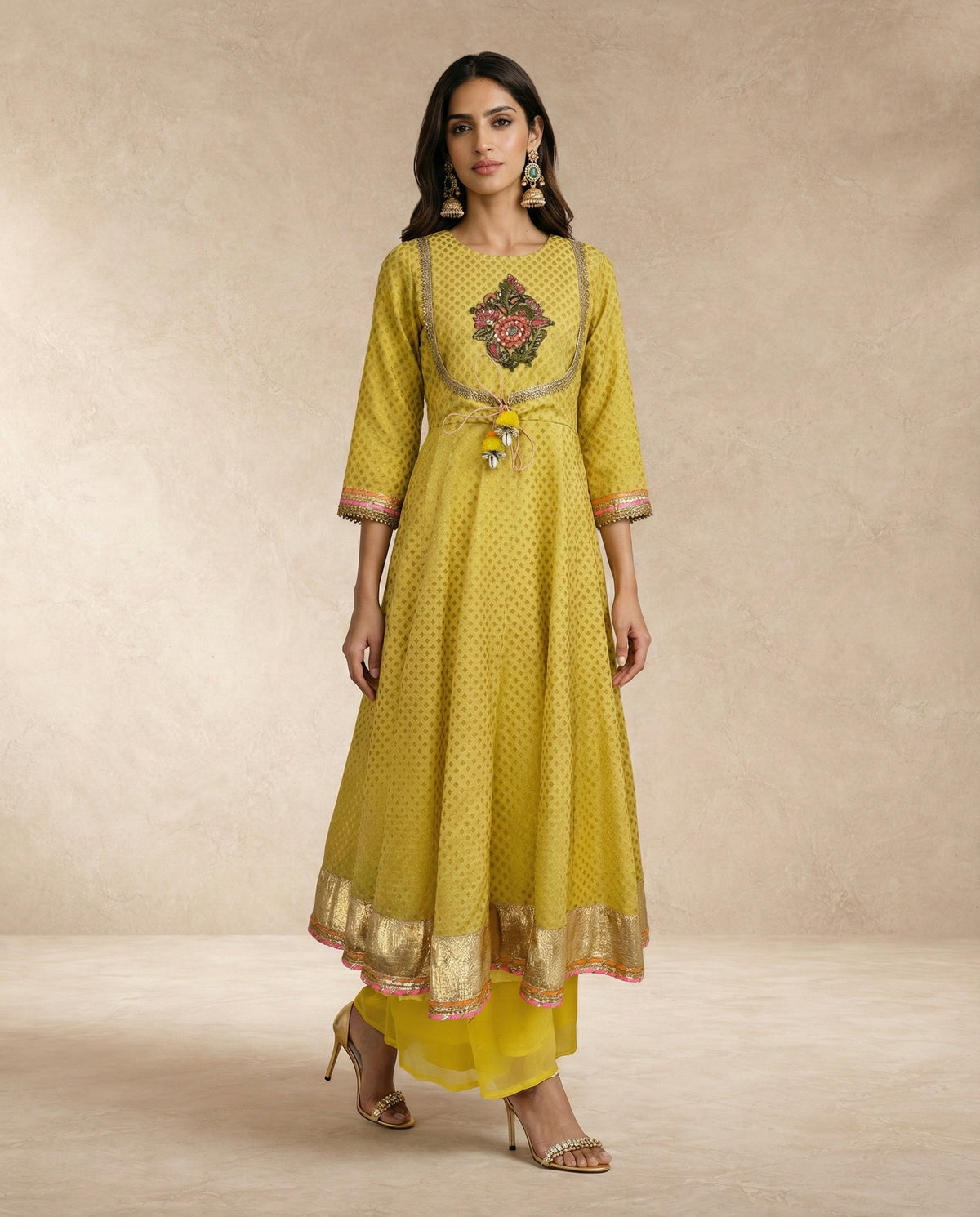 NAZAKAT mustard anarkali set with woven gold hem border by Neha Sharma Label.