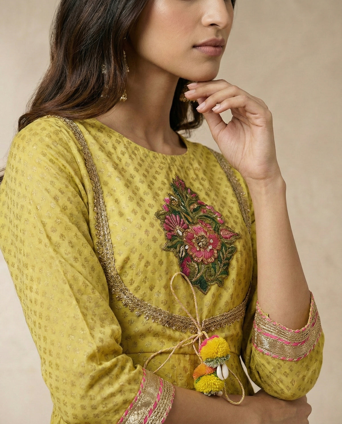 NAZAKAT mustard anarkali with gota-trimmed yoke and embroidered floral bouquet by Neha Sharma Label.