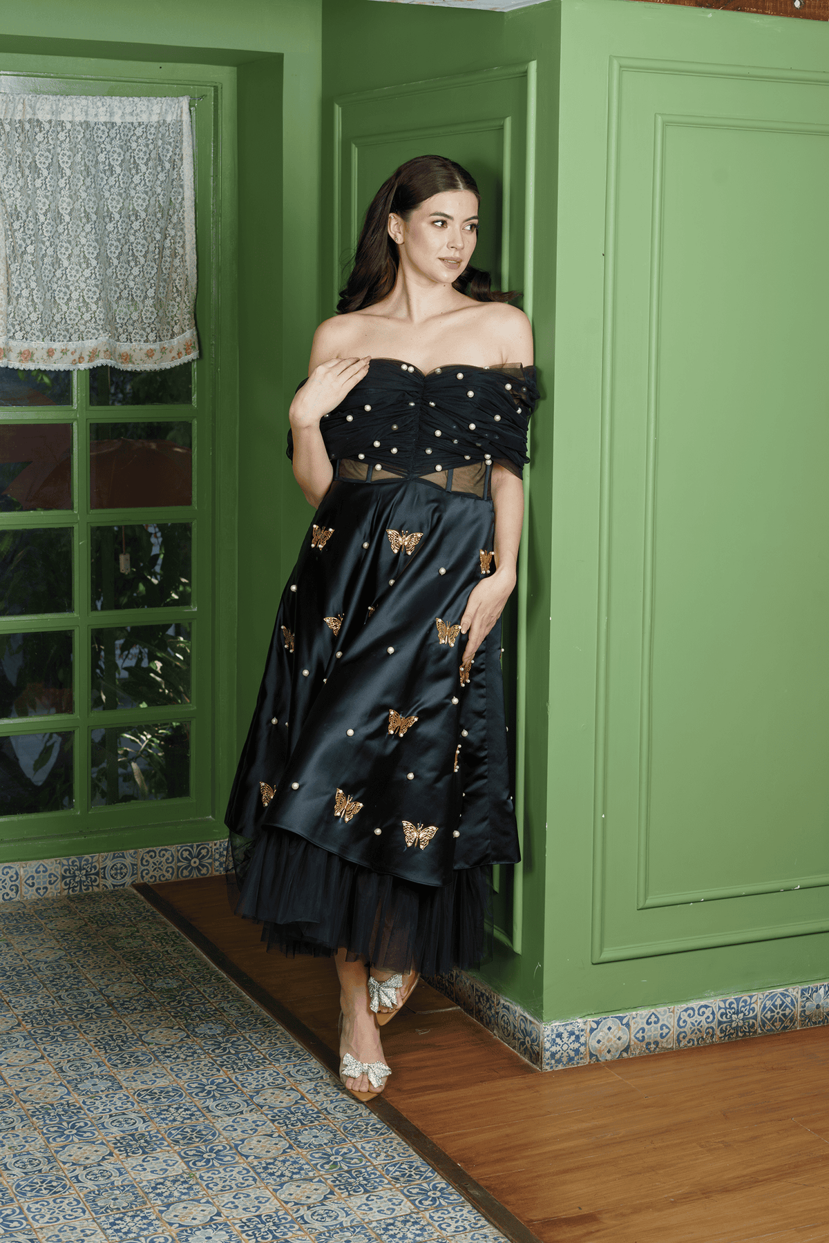 Midnight Siren dress, three-quarter view showing the sheer corset waist and metal-butterfly satin skirt