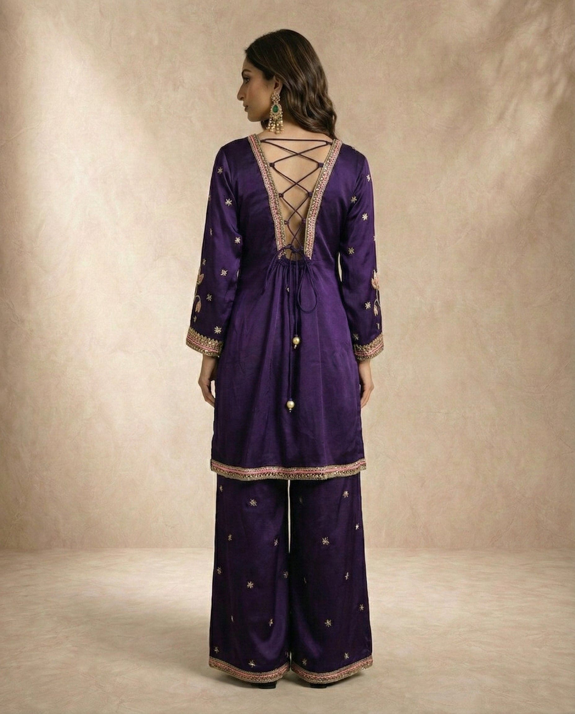 NAZME purple silk kurta with lace-up back and pearl-drop ties by Neha Sharma Label.