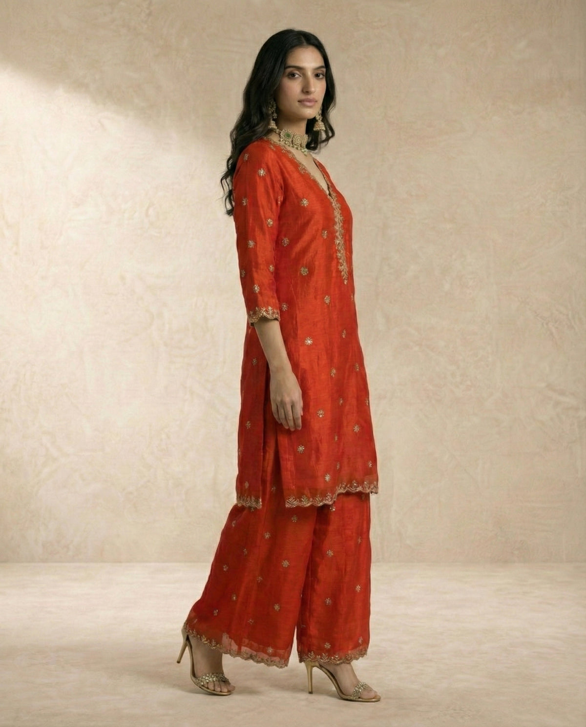 Gold sequin vine embroidery and scalloped borders on the SAMARA vermilion kurta by Neha Sharma Label.