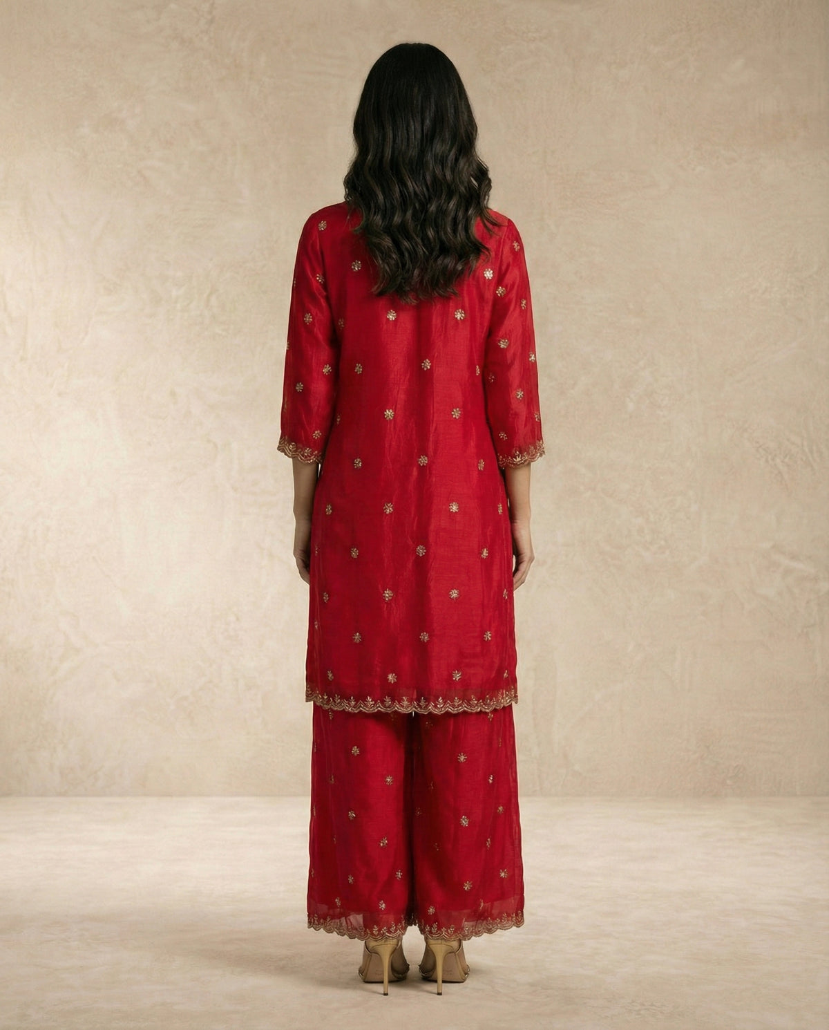 Detail of NAZRA's gold leaf-vine machine embroidery and sequin butis on red tissue silk.