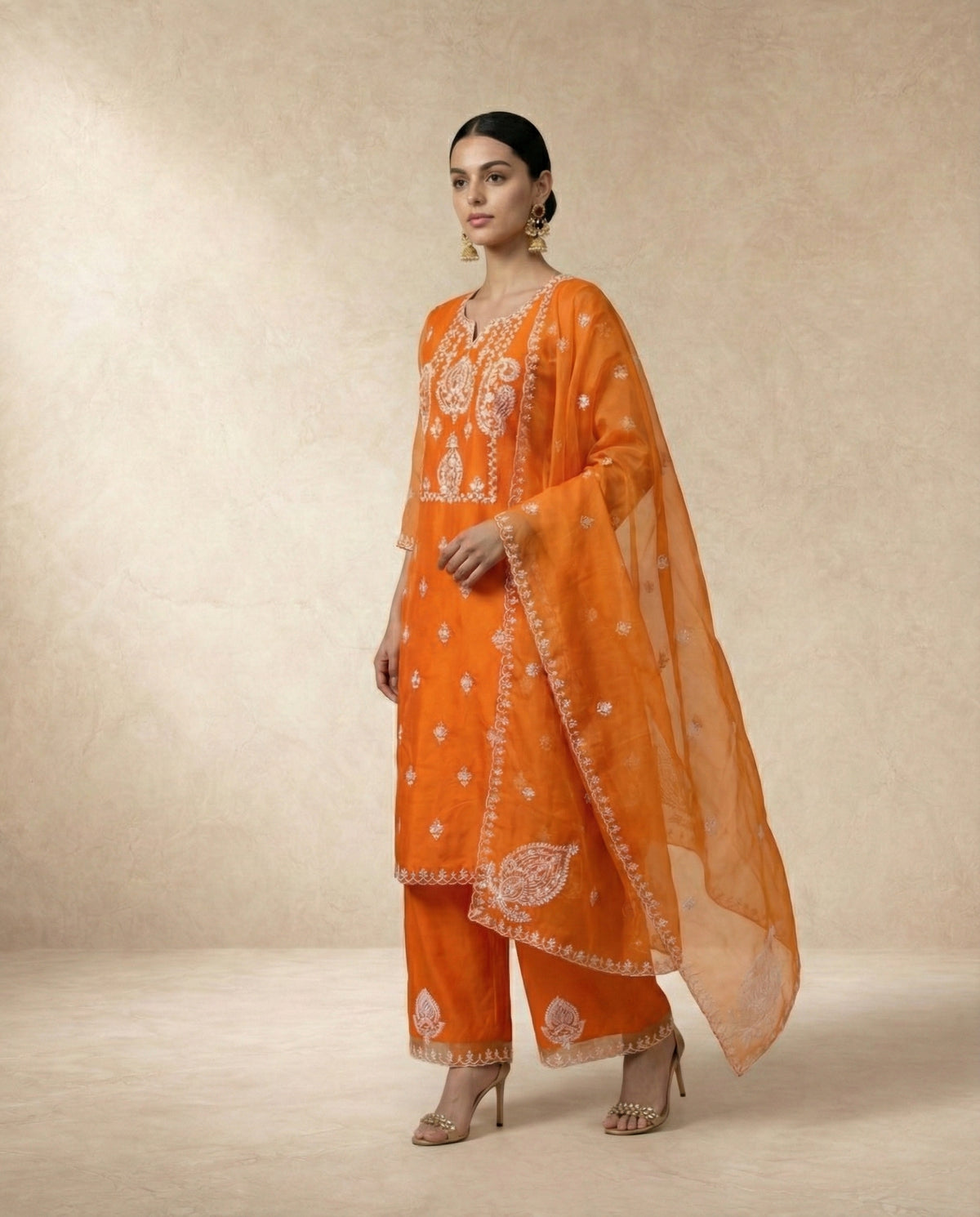 Neha Sharma Label IFRA orange organza kurta set with ivory embroidery and scalloped dupatta.