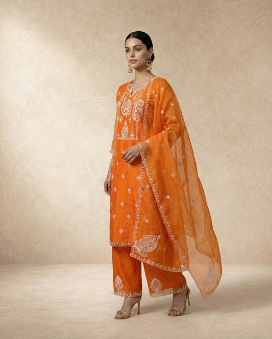 Neha Sharma Label IFRA orange organza kurta set with ivory embroidery and scalloped dupatta.