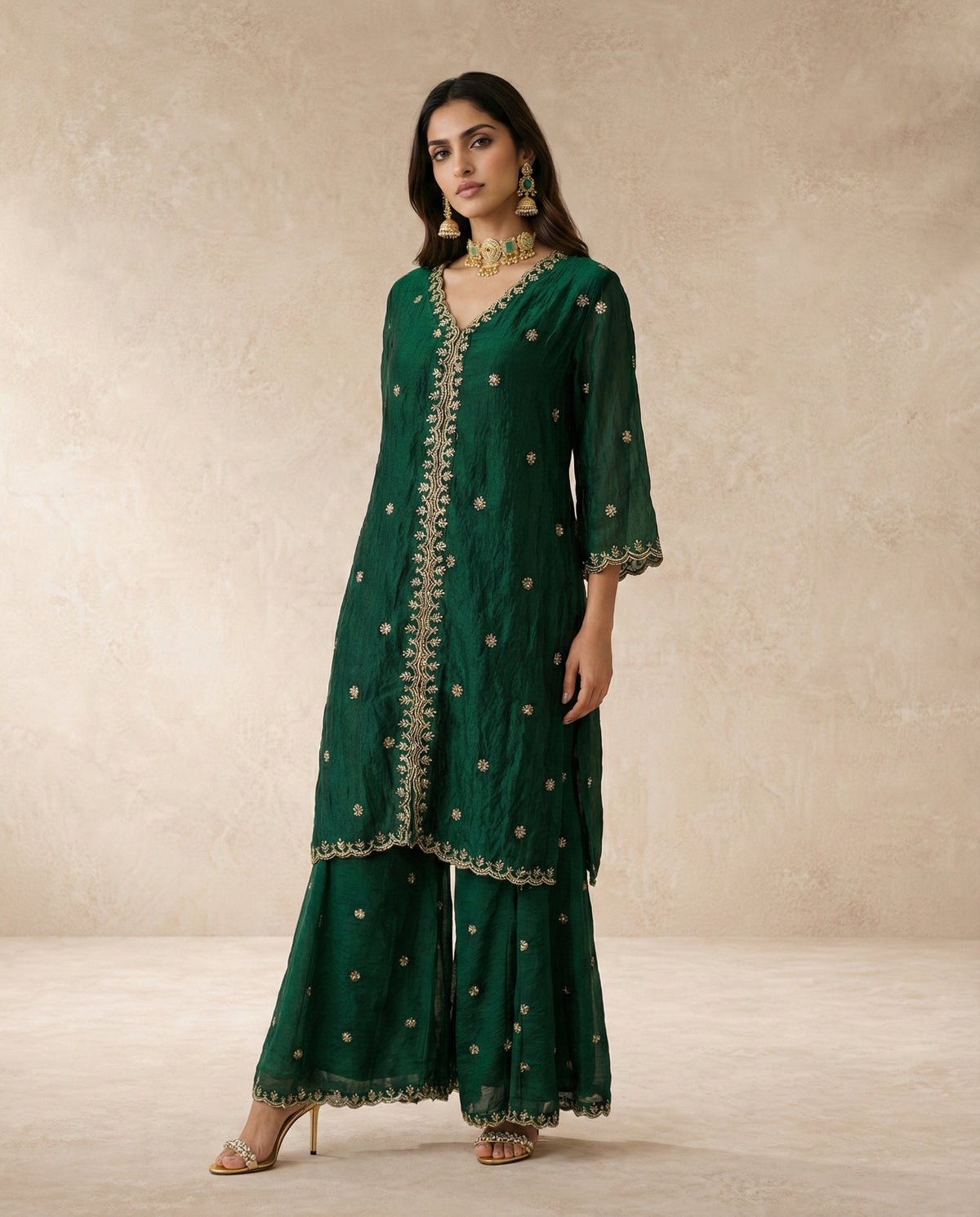 Ferdos emerald tissue silk set styled with the gota-edged embroidered dupatta.