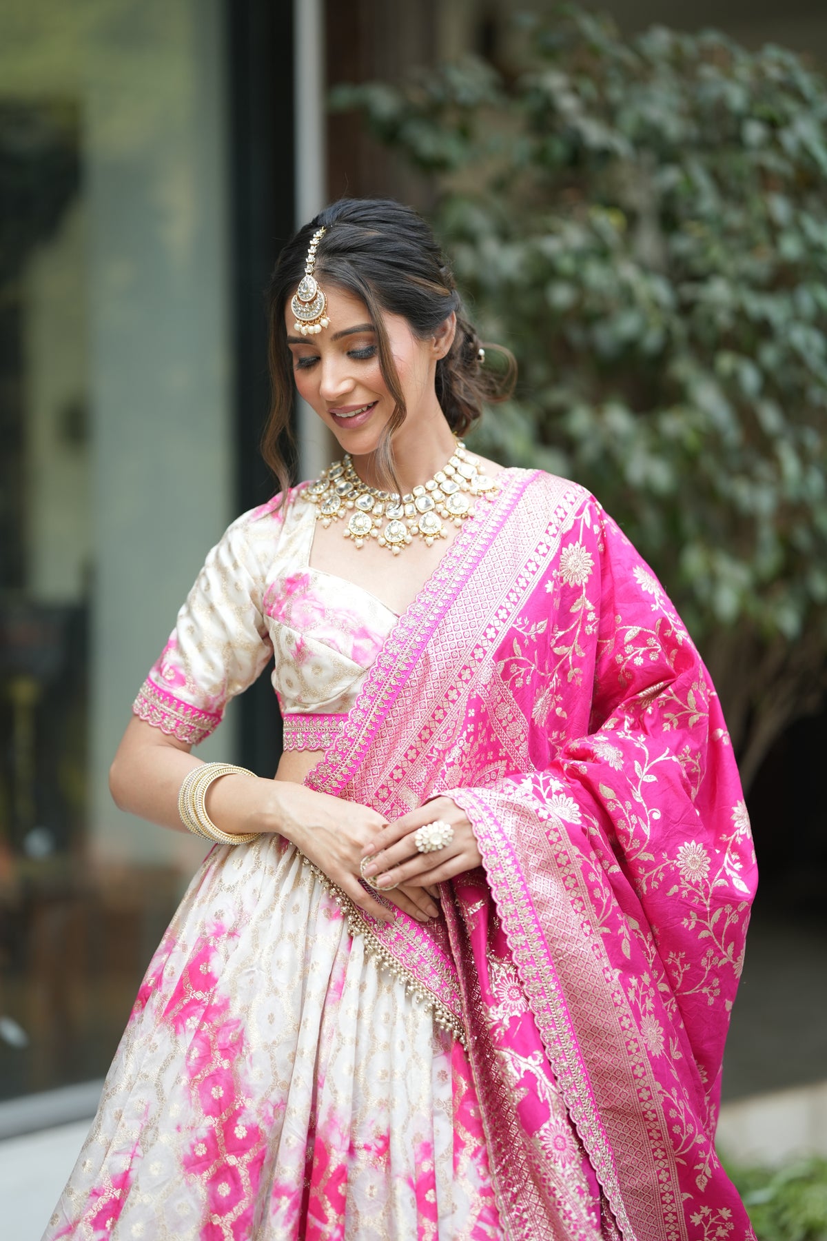 Banarasi silk bridal lehenga with pure Banarasi dupatta draped over shoulder ? traditional wedding wear look for women.