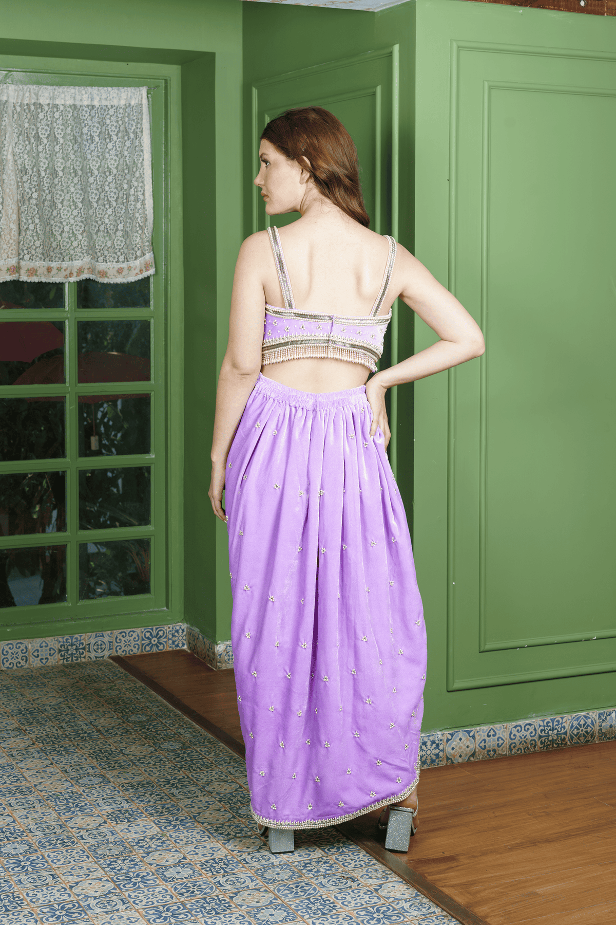 Back view of Indo Western dhoti skirt and crop top in lilac velvet with pearl straps.