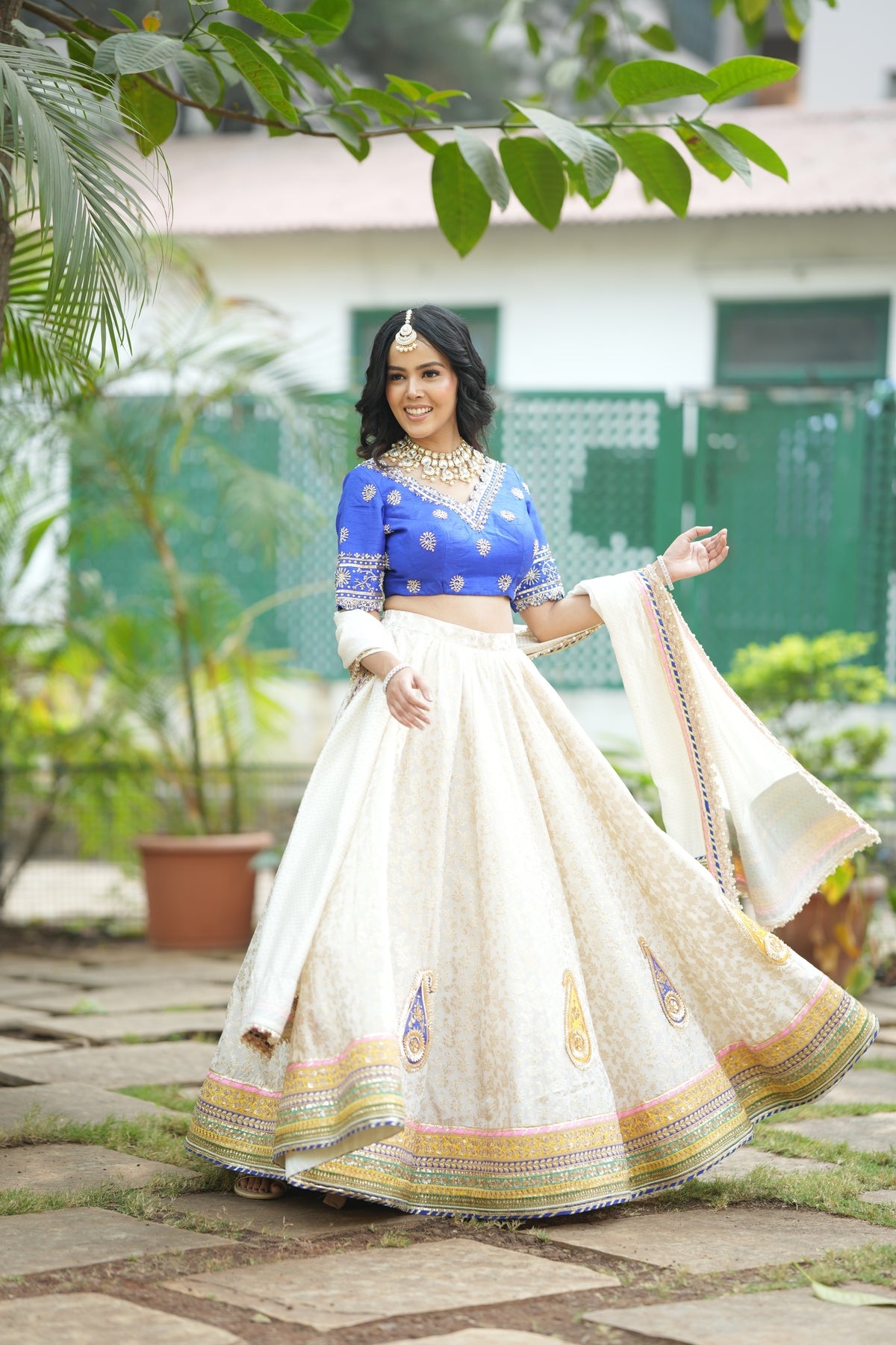 Ivory dupatta with scalloped lace borders and subtle embroidery detail.