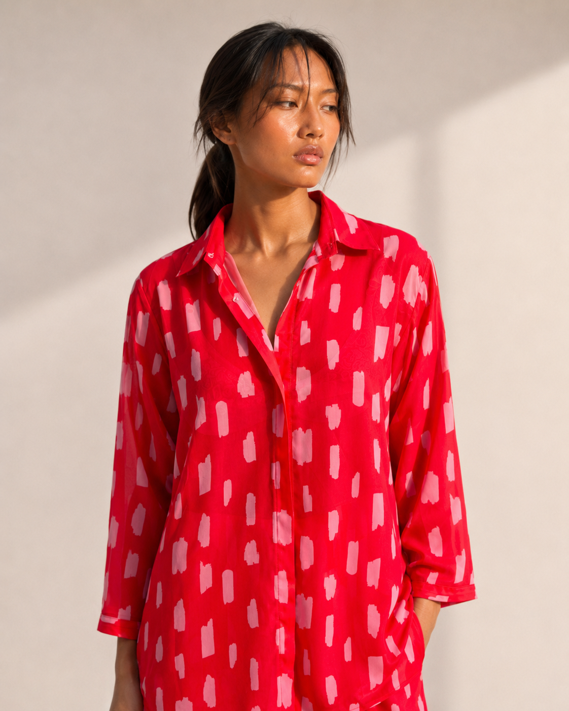Detail of the pink brushstroke print on the SCARLETT red co-ord set.