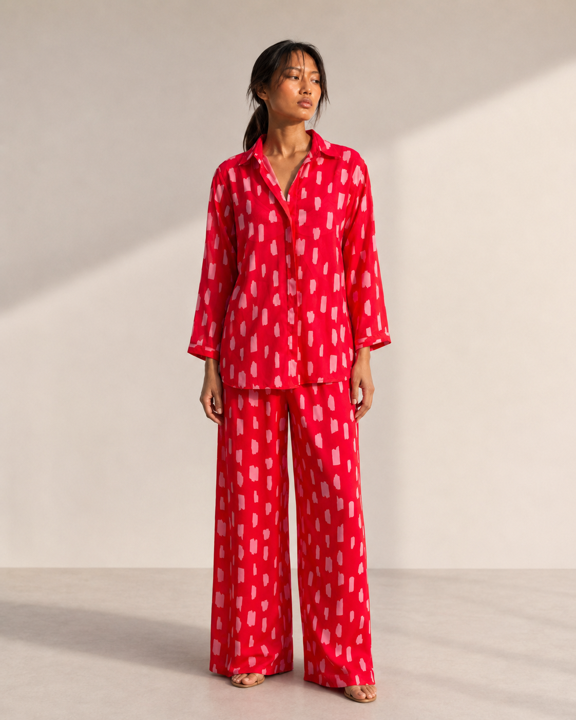 Model wearing SCARLETT red brushstroke print co-ord set by Neha Sharma Label.