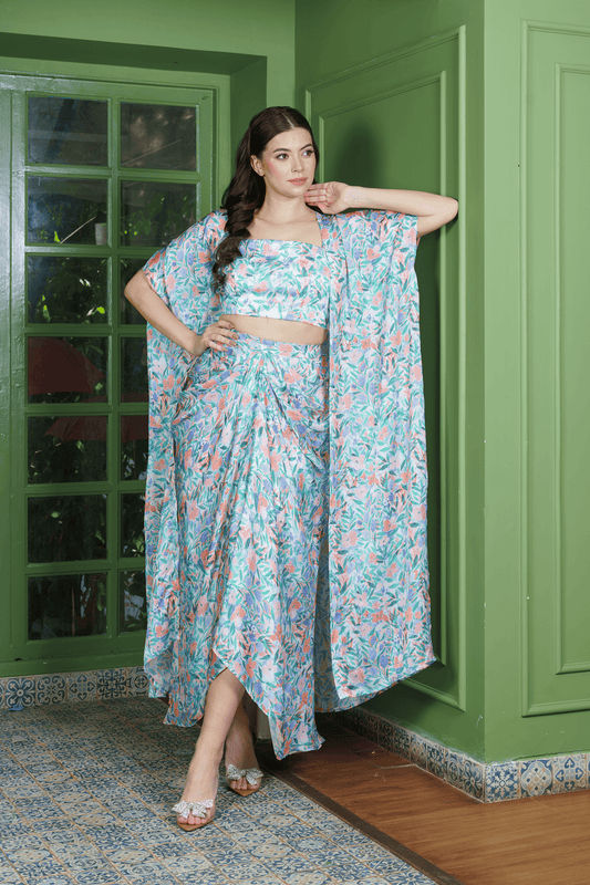 Model wearing leafy print dhoti set for women with crop top and long jacket ?perfect indo western outfit for festive and wedding occasions.