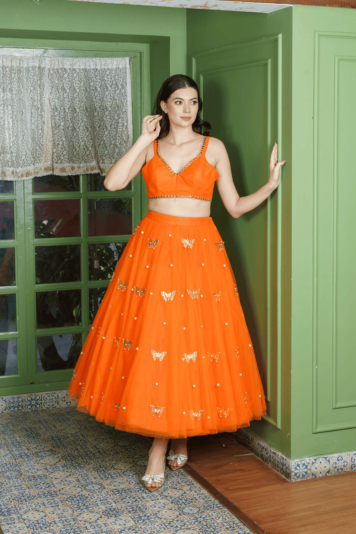 orange lehenga choli with pearl accents for party wear