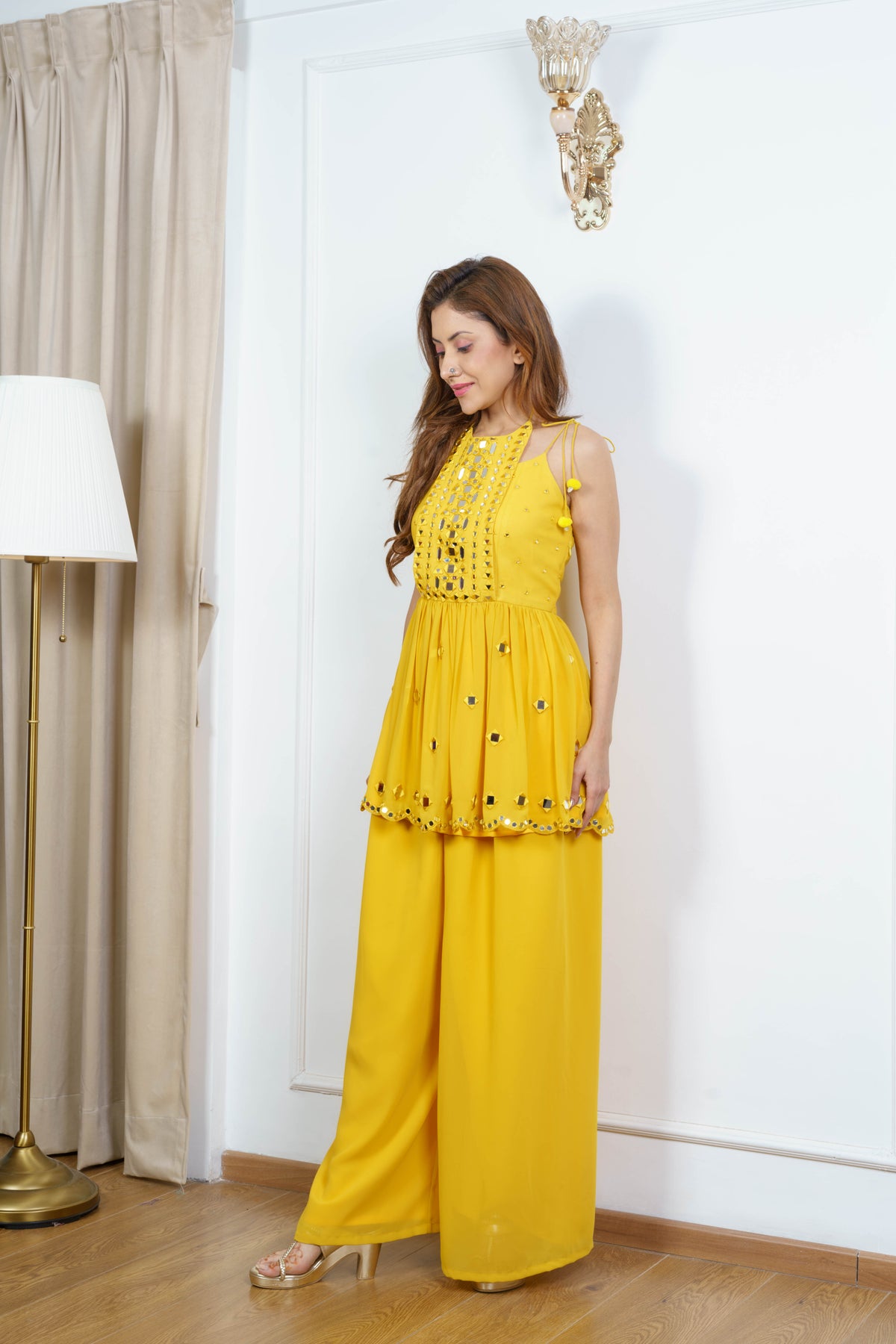 ZIA marigold mirror work flap kurta styled front view showing the gathered flap and mirror detailing.
