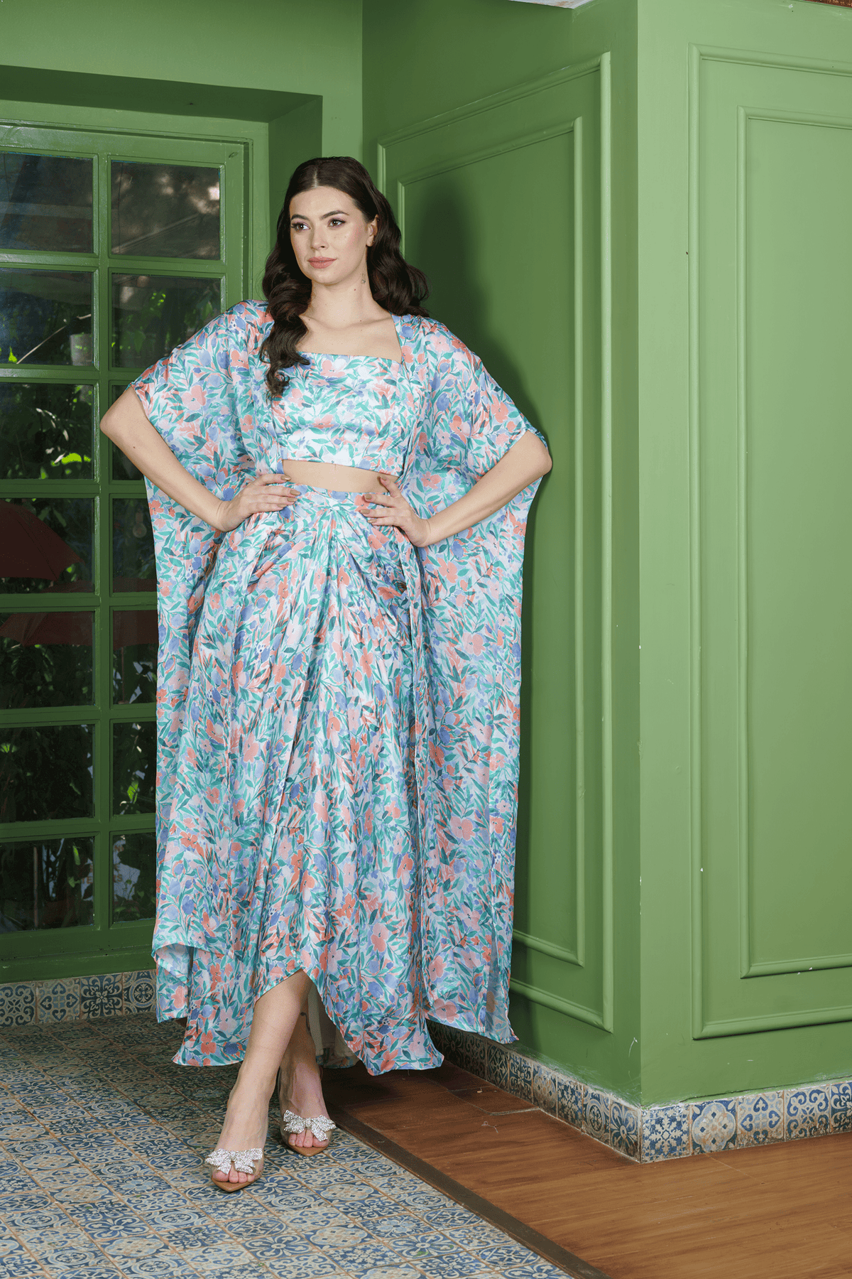 Trendy leafy print dhoti set for women featuring a crop top, draped skirt, and long jacket ?stylish indo western fusion wear for festive occasions.