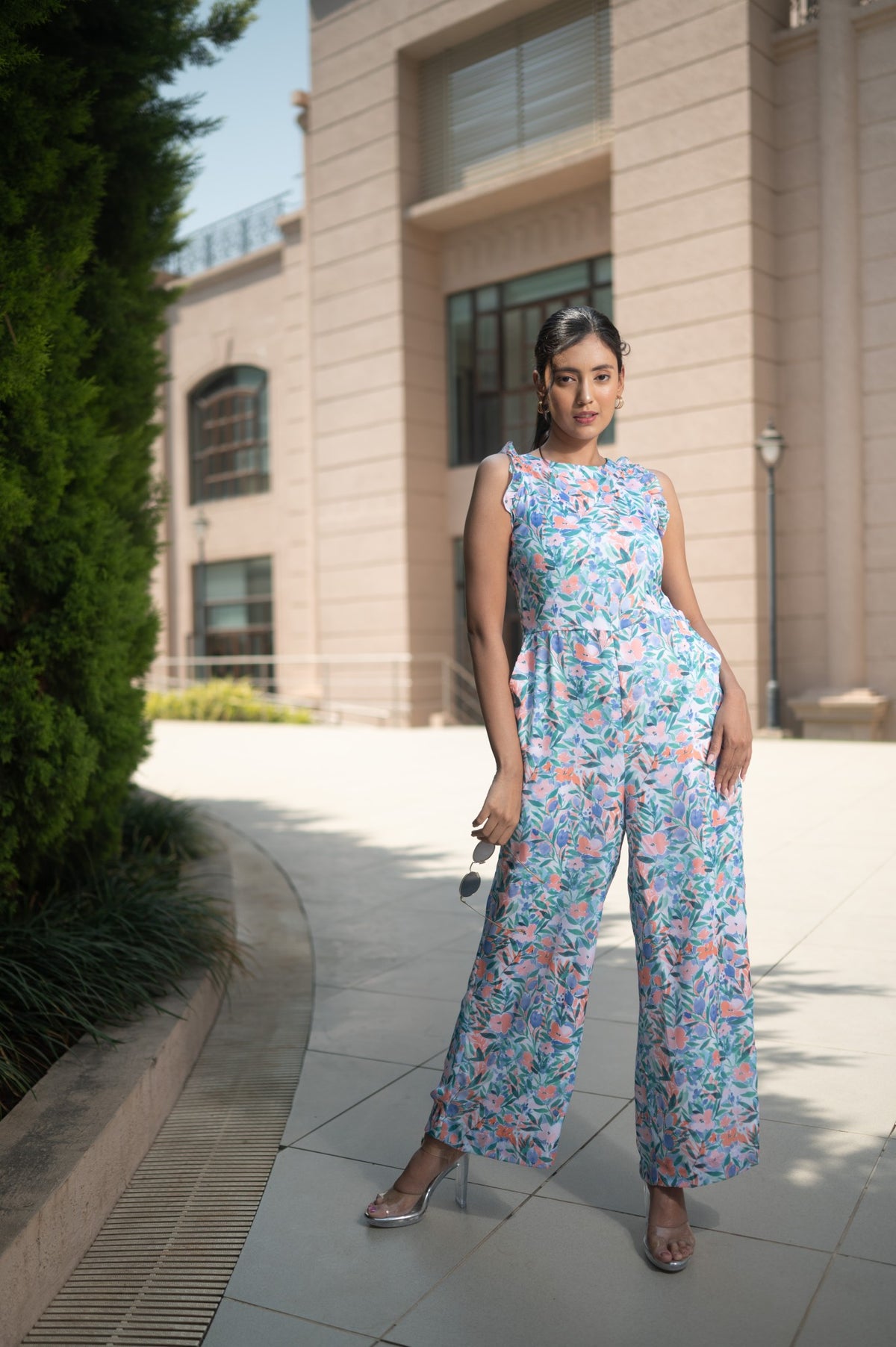 Detail of the blue, coral and green watercolour floral print on the FLEUR jumpsuit.