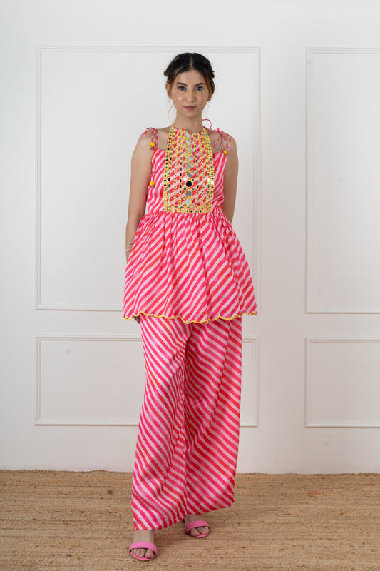 Paakhi pink candy leheriya flap kurta set in imported satin with real mirror yoke and yellow scalloped hem.