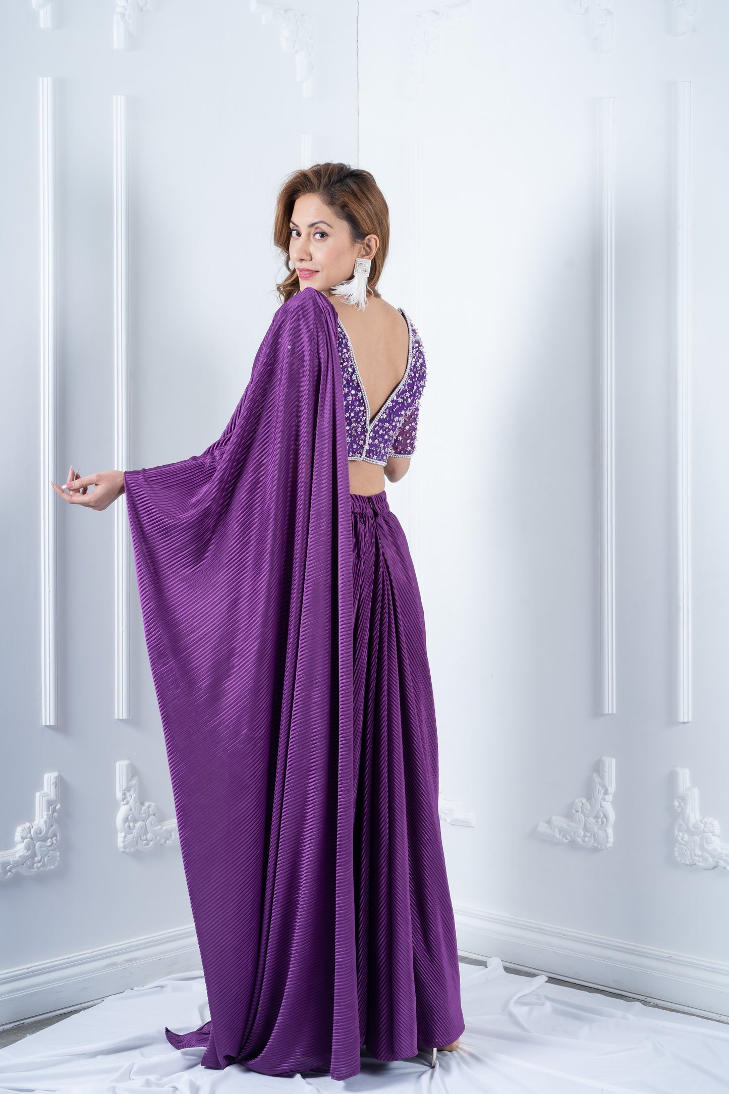 Purple hand embroidered blouse with pleated drape saree