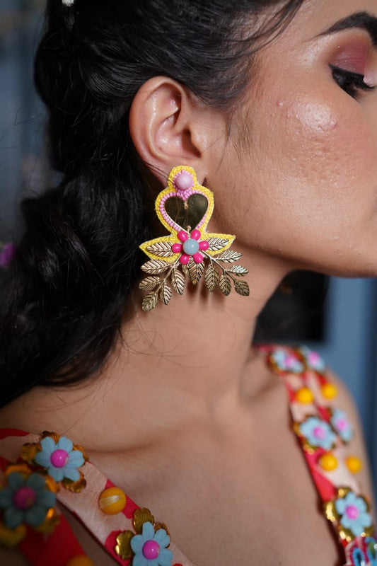 Yellow mirror beaded earrings .