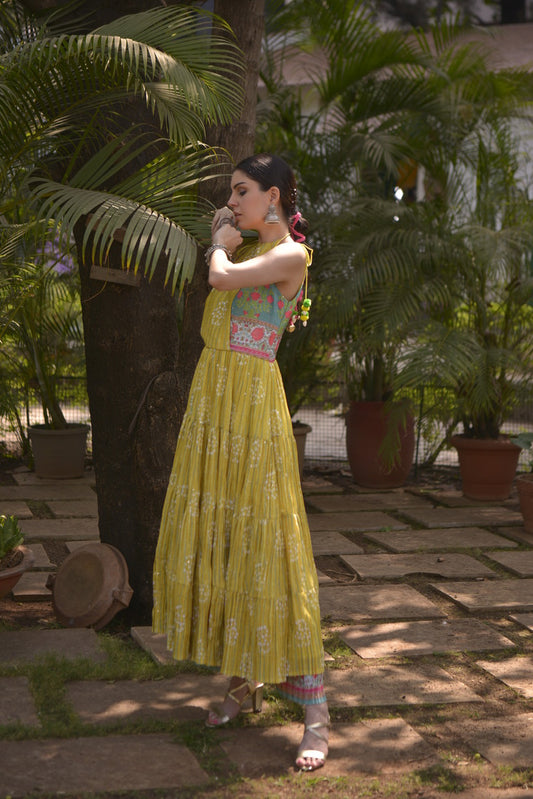 IRA citron-mustard bandhani print tiered anarkali set with teal floral bodice panels.